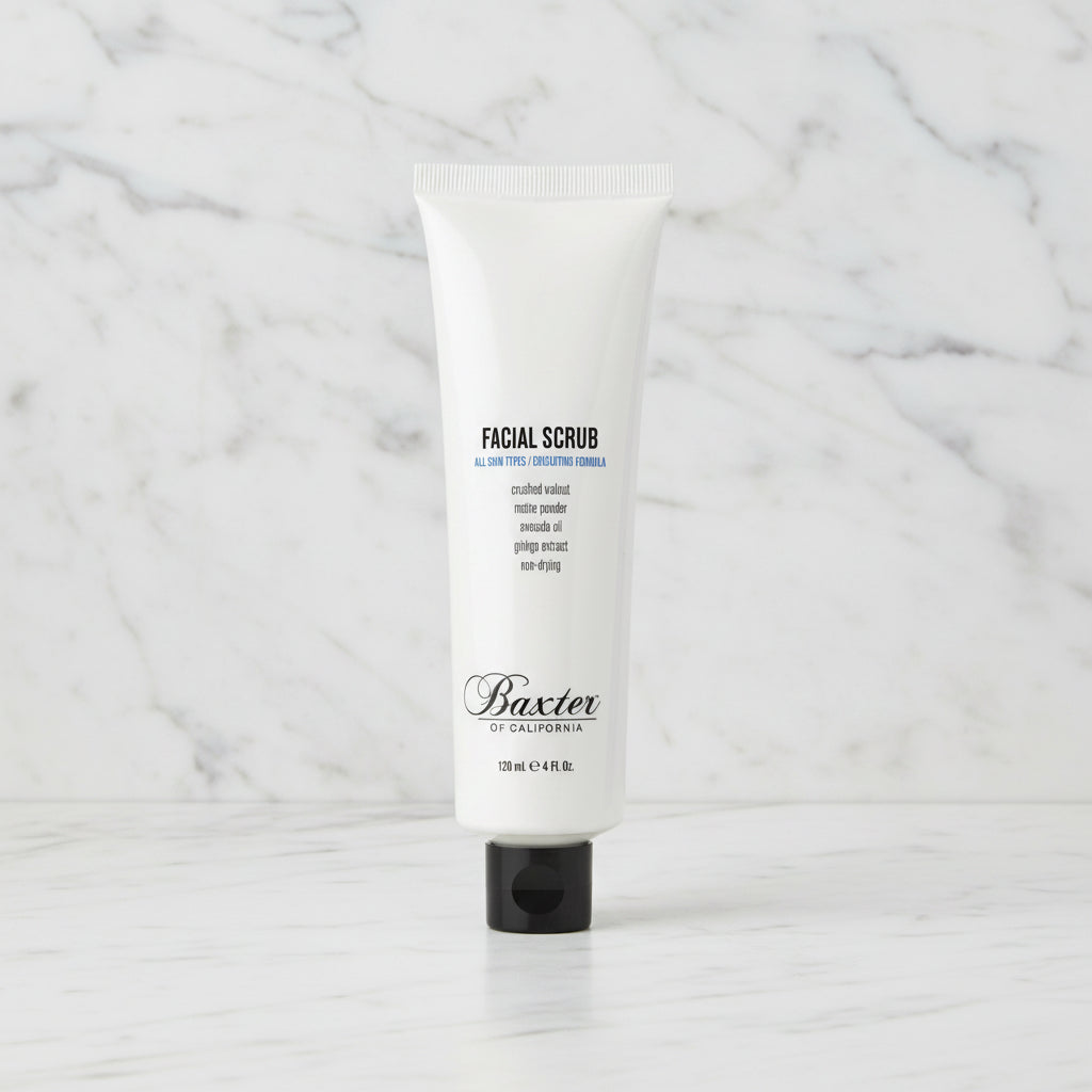A white squeeze tube of Baxter by Salvador Facial Scrub with a black cap, centered on a plain white background.