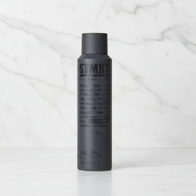 Black hair spray bottle with text on a white background