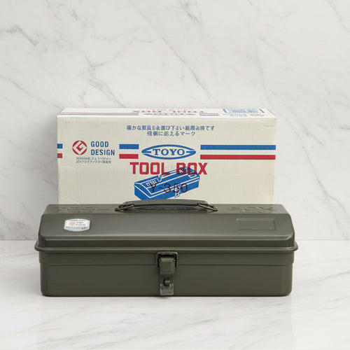Green tool box in front of a Toyo toolbox packaging on a white background