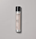 Ultradynamics hair care product bottle on a gray background